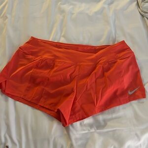 Coral Nike shorts